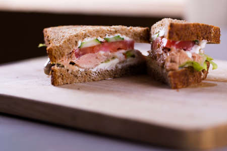 Cooking fresh homemade grilled tuna sandwich on a woodの写真素材