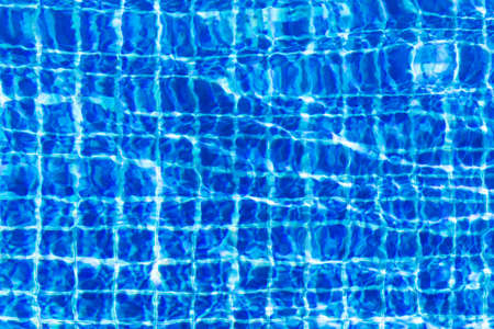 Water surface in turquoise swimming pool - holiday tropical background conceptの写真素材