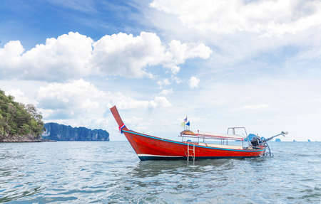 Amzing landscape with traditional longtail boats, rocks, cliffs, beautiful sea tropical and white Ao Nang beach. Popular famous travel vacation  destination Krabi Province, Thailand.の写真素材