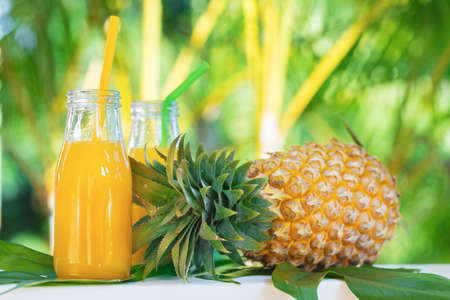 Fresh yellow pineapple tropic fruit summer refreshment smoothie shake drink outdoorsの写真素材