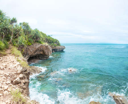 Idillic Bali coral ocean coast with turquoise waterの写真素材