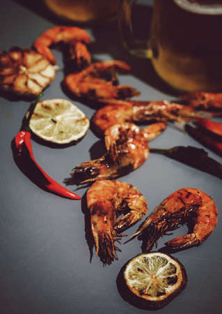 Fresh grilled prawn shrimps on a grey backgroundの写真素材