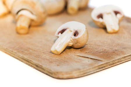 Fresh champignon mushrooms on a wooden deskの写真素材