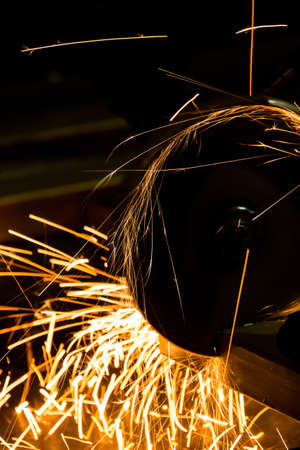 sharpening and cutting of iron by abrasive disk machine industrial