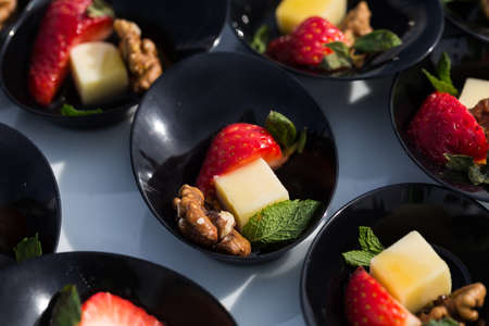 Starting party snack: cheese, strawberry nut and mintの写真素材