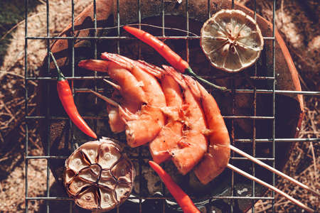 Fresh shrimps on barbecue outdoorsの写真素材