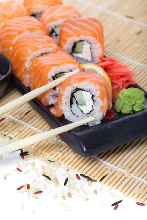 Fresh salmon sushi rolls on a woodenの写真素材