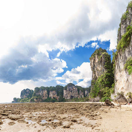 Popular travel tropical karst rocks perfect for climbing Tonsai low tide water beach, Krabi province, Thailandの写真素材
