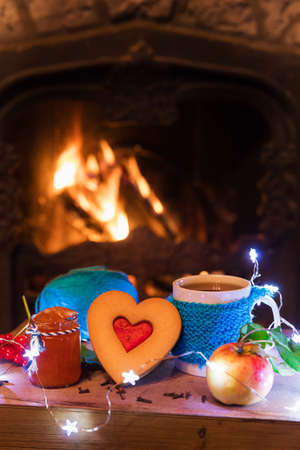 Tasty Christmas composition near winter hot fireplaceの写真素材