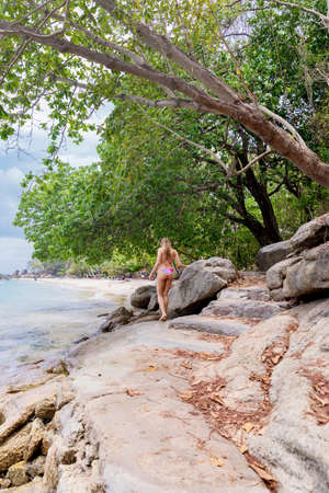 Young woman on the white beach near the seaの写真素材