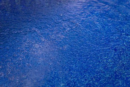 Water surface in blue swimming poolの写真素材