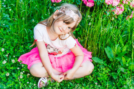 Summer portrait of a cute little girlの写真素材