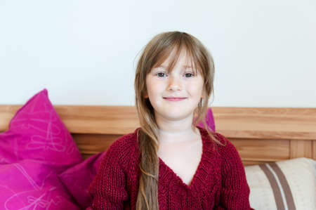 Adorable little girl in pullover in parent\\\\の写真素材