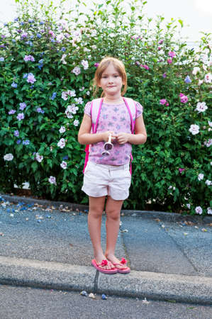 Beautiful little girl going to school outdoorsの写真素材