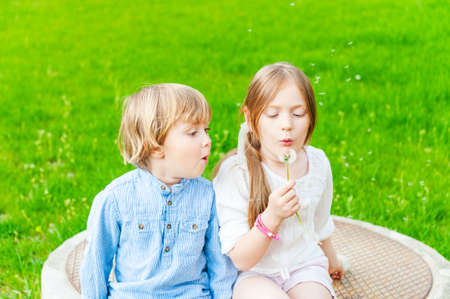 Adorable children playing together on a nice summer day, outdoorsの写真素材