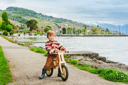 Cute little toddler boy playing outdoorsの写真素材