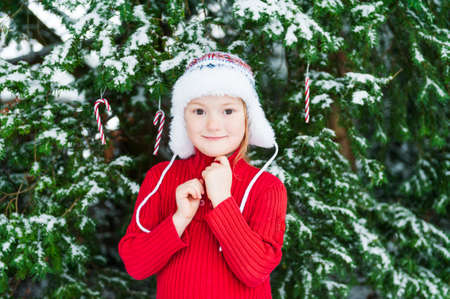 Winter portrait of a cute little girlの写真素材