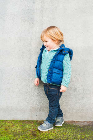 Outdoor portrait of a cute toddler boyの写真素材