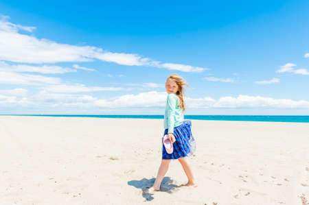 Cute little girl having fun outdoorsの写真素材