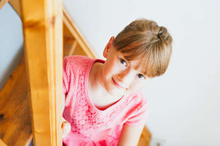 Interior portrait of a cute little girlの写真素材