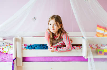 Portrait of adorable little girl in her roomの写真素材