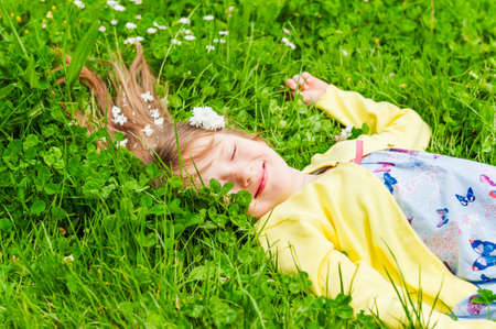 Summer portrait of a cute little girl on a nice sunny dayの写真素材