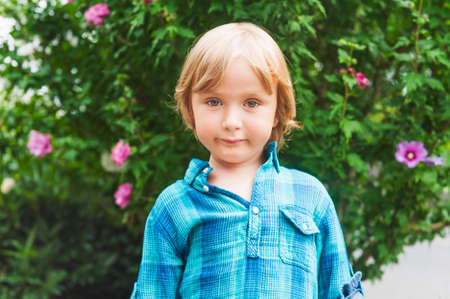 Outdoor portrait of a cute toddler boyの写真素材
