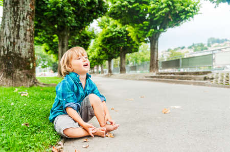 Outdoor portrait of a cute toddler boyの写真素材