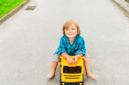 Outdoor portrait of a cute toddler boyの写真素材
