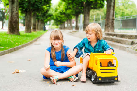 Adorable children playing together on a nice summer dayの写真素材