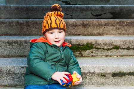 Outdoor, portrait of a cute toddler boyの写真素材