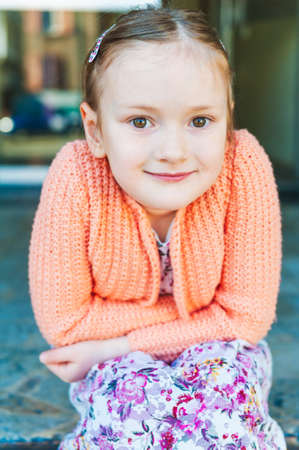 Outdoor portrait of a cute little girl against amazing viewの写真素材