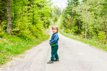 Cute toddler boy in a forestの写真素材
