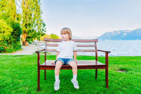 Cute toddler boy playing outdoorsの写真素材