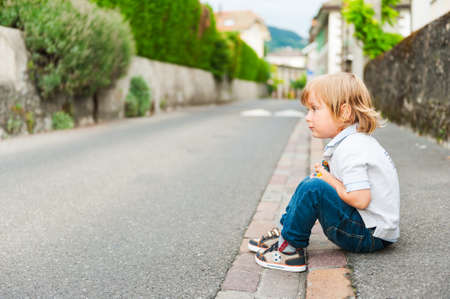 Outdoor portrait of adorable toddler boyの写真素材