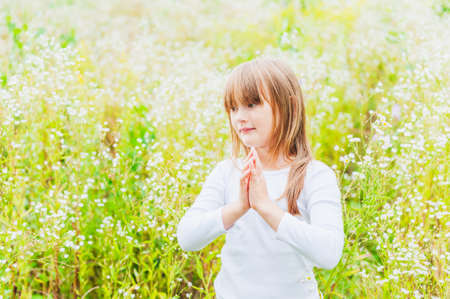 Outdoor portrait of a cute little girlの写真素材
