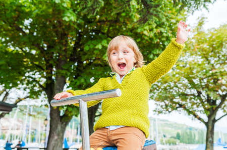 Cute toddler boy playing on playgroundの写真素材