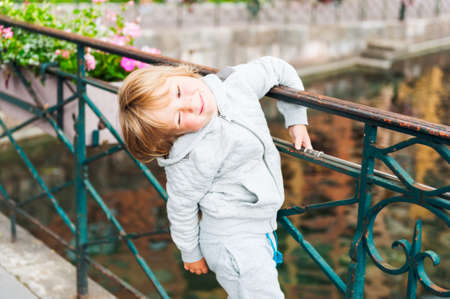 Outdoor portrait of a cute toddler boyの写真素材