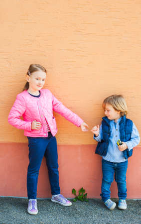 Outdoor portrait of two adorable childrenの写真素材