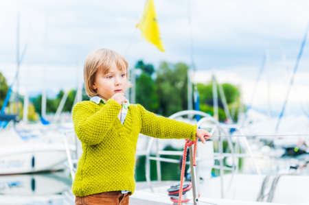 Outdoor portrait of a cute toddler boyの写真素材