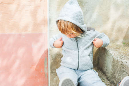 Outdoor portrait of a cute toddler boyの写真素材