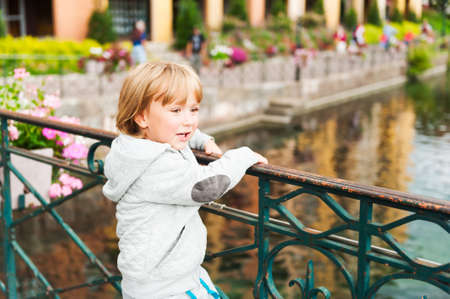 Outdoor portrait of a cute toddler boy in a forestの写真素材