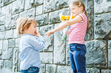 Outdoor portrait of two adorable childrenの写真素材