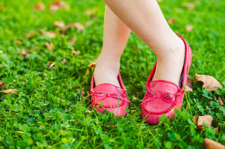 Close up of red moccasins on child\'s feetの写真素材