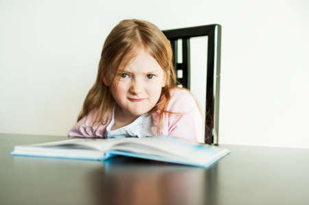 Angry little girl portrait indoorsの写真素材