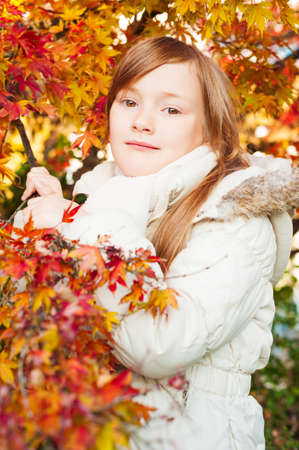 Autumn portrait of a beautiful little girlの写真素材