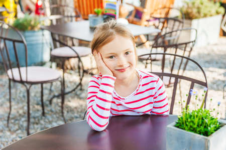 Outdoor portrait of a cute little girl on a nice sunny dayの写真素材