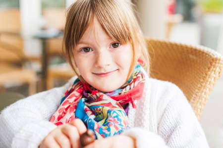 Close up portrait of a cute little girl of 4 years oldの写真素材