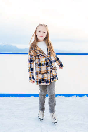 Little girl on skating rinkの写真素材
