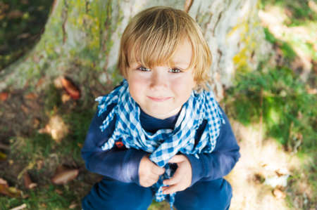 Outdoor portrait of a cute toddler boyの写真素材